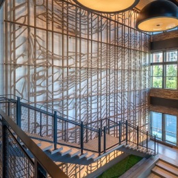 a room with large lights and stairs