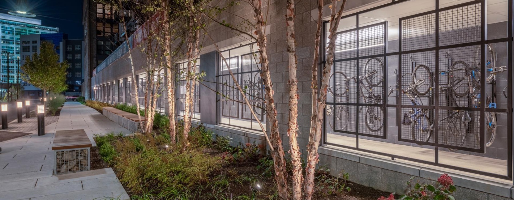 a building with trees and plants in front of it