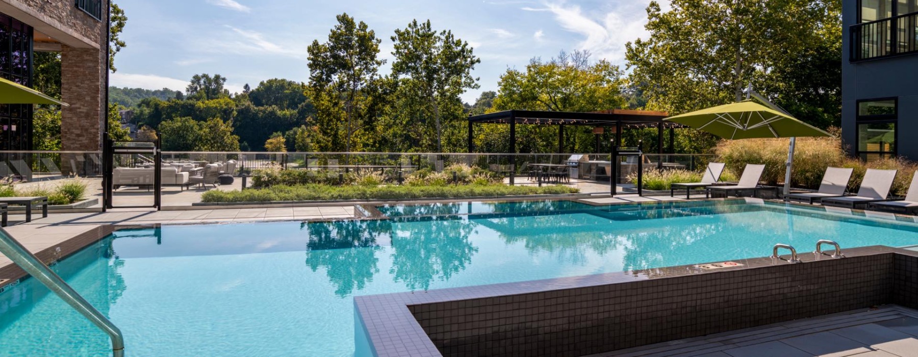 a swimming pool with a building in the background