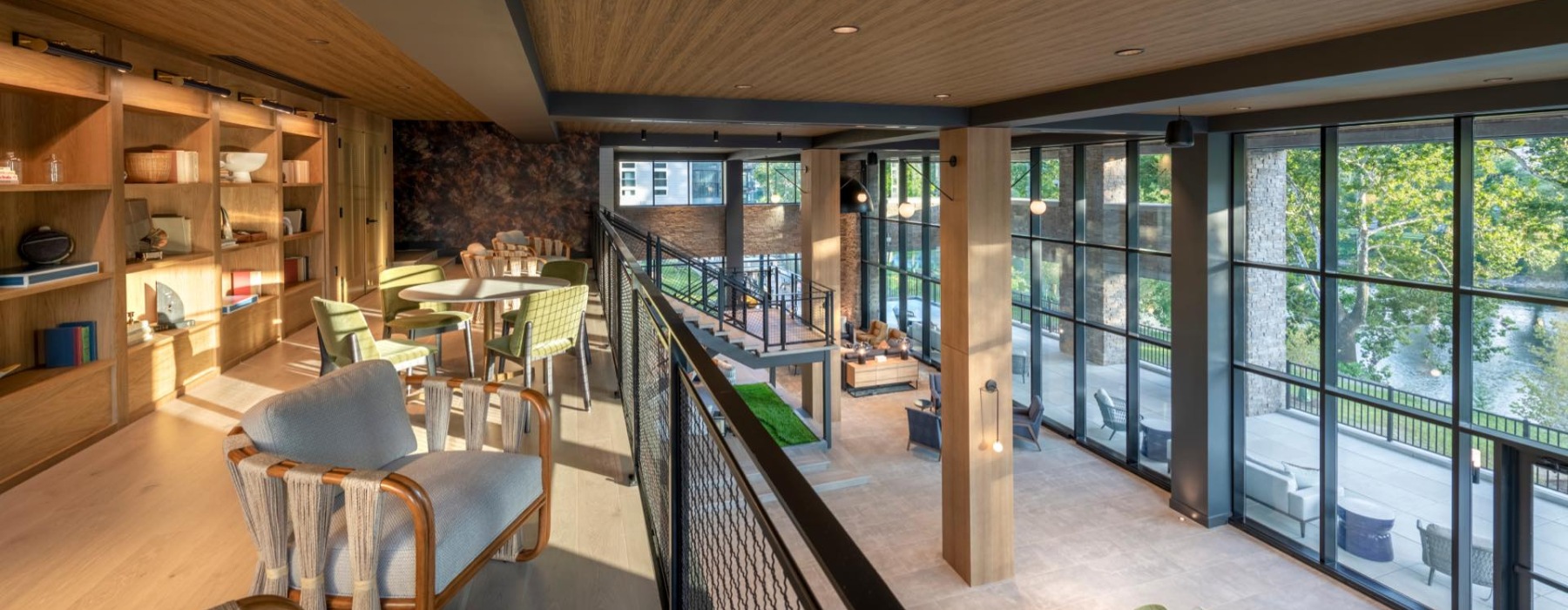 a clubroom upper level with tables and chairs